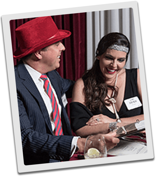 Boston Murder Mystery couple checking out the dinner menu