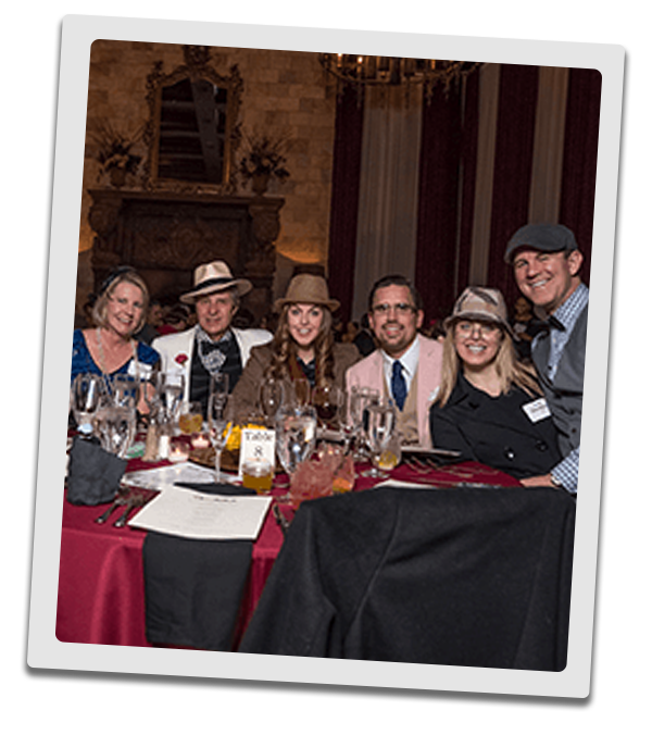 Boston Murder Mystery party guests at the table